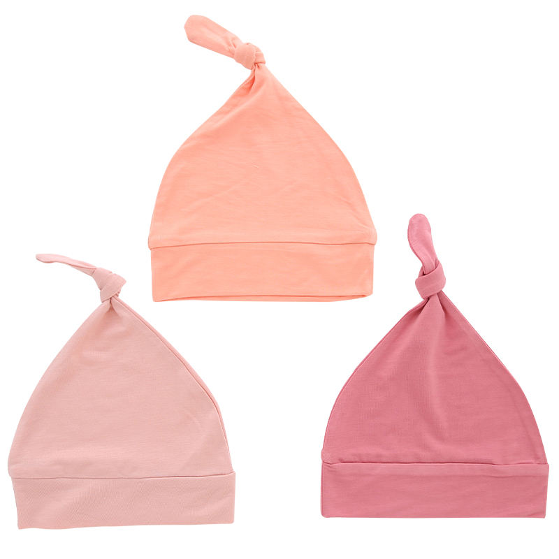 Sombreros de bebé al por mayor, tela de bambú, dulce color sólido, decoración facial OEM, sombreros de bebé unisex personalizados para todas las estaciones