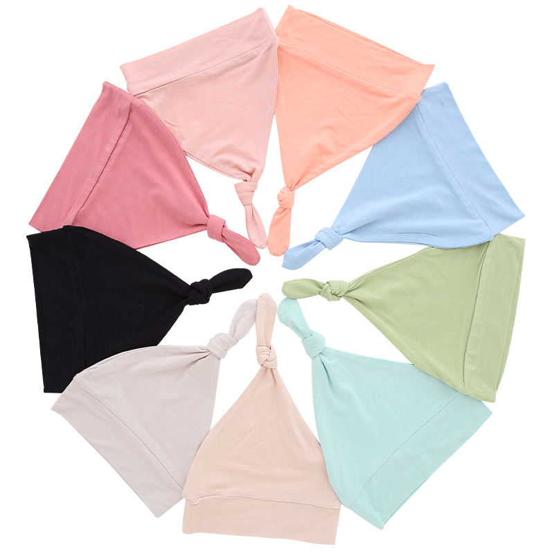 Sombreros de bebé al por mayor, tela de bambú, dulce color sólido, decoración facial OEM, sombreros de bebé unisex personalizados para todas las estaciones