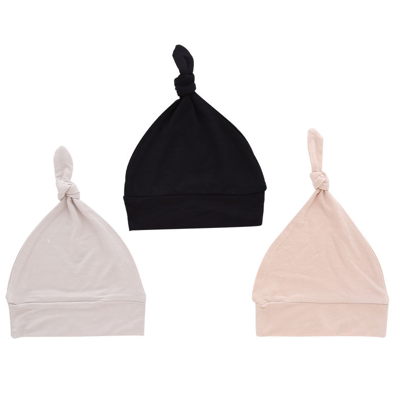Sombreros de bebé al por mayor, tela de bambú, dulce color sólido, decoración facial OEM, sombreros de bebé unisex personalizados para todas las estaciones