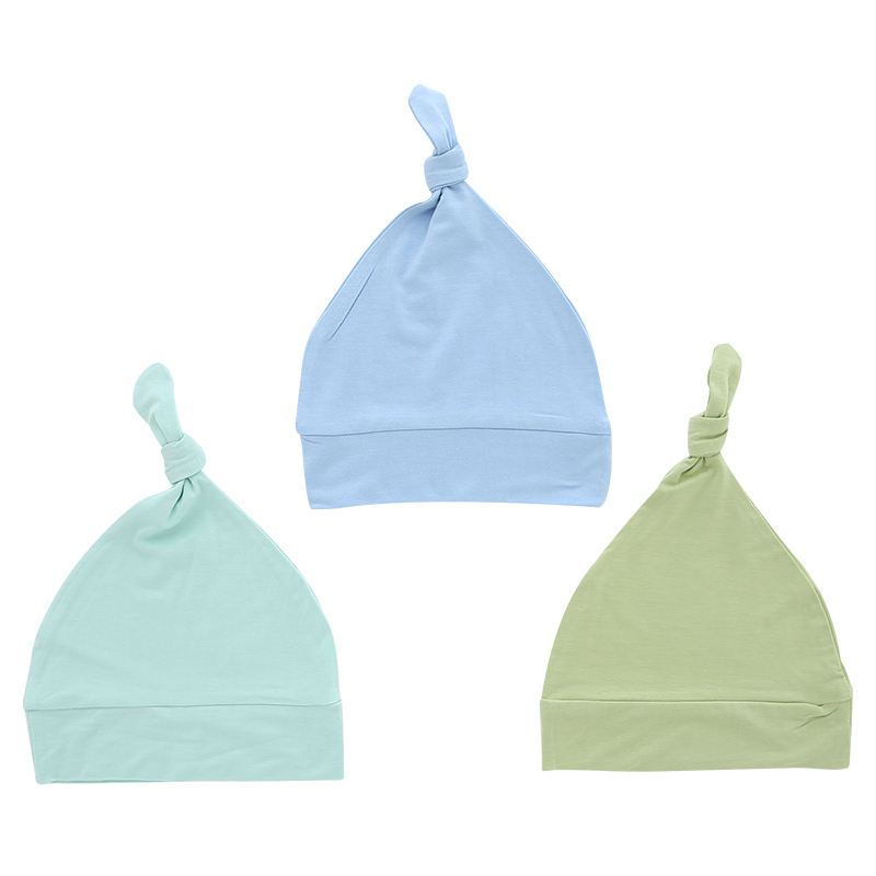 Sombreros de bebé al por mayor, tela de bambú, dulce color sólido, decoración facial OEM, sombreros de bebé unisex personalizados para todas las estaciones